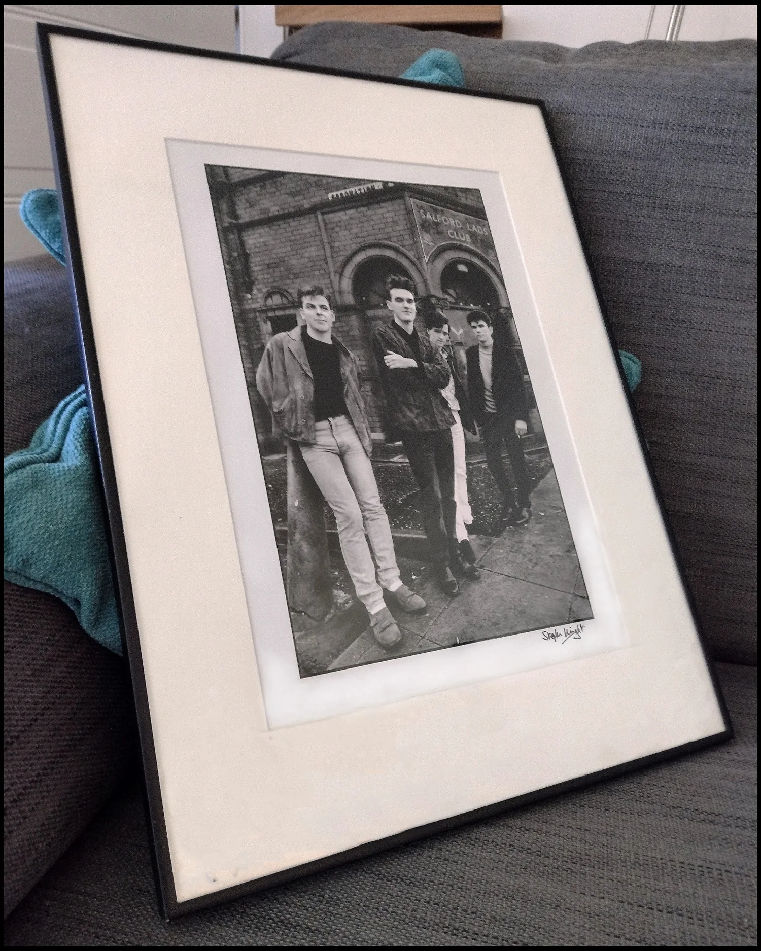 Framed signed photograph of The Smiths outside Salford Lads Club
